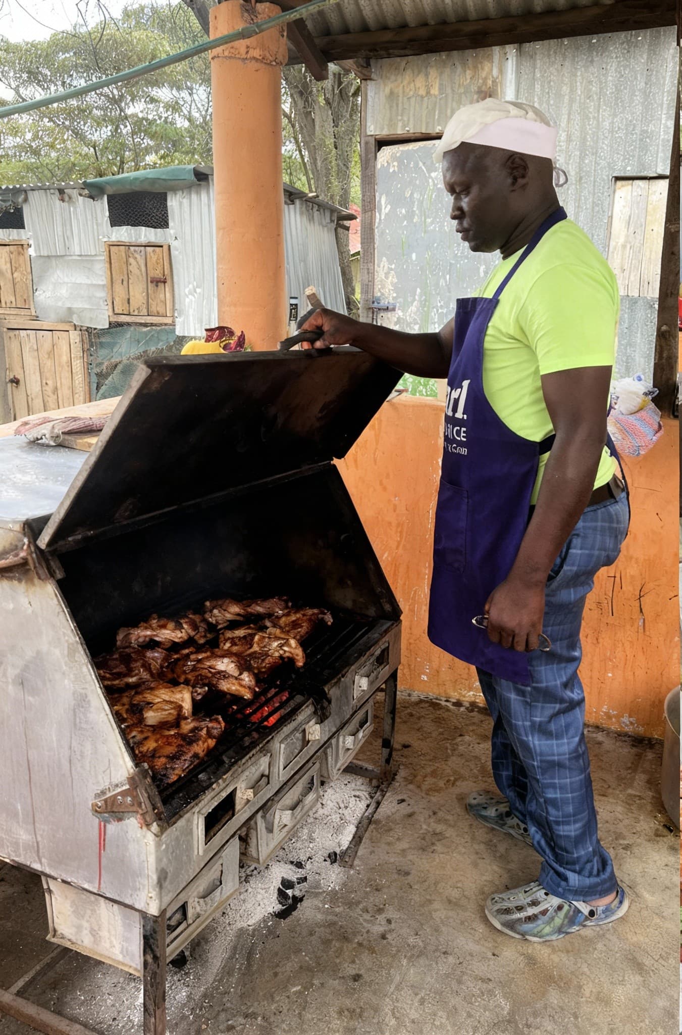 Traditional nyama choma grilling preparation at Tongue Tang Meadows